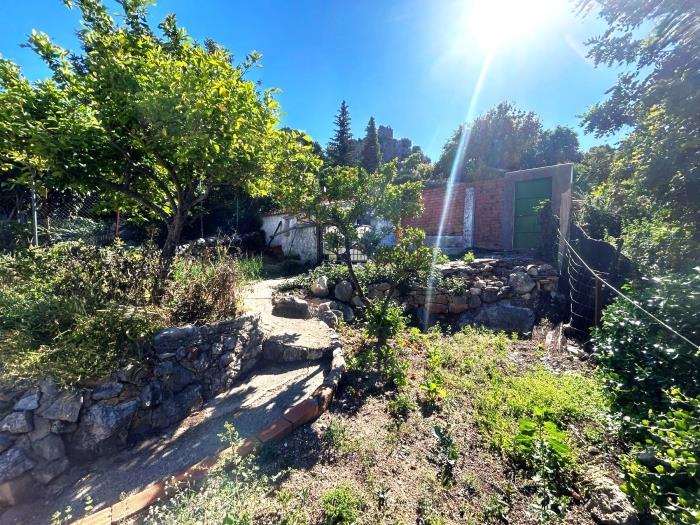 Property with a garden and the possibility of a large garage.